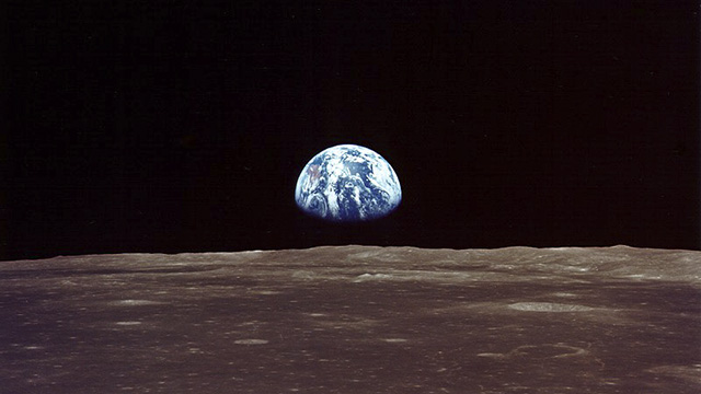 Earthrise over the lunar horizon taken from the orbiting Command Module of Apollo 11, July 20, 1969. 