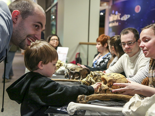 Checking out the hominid fossils at Darwin Day.