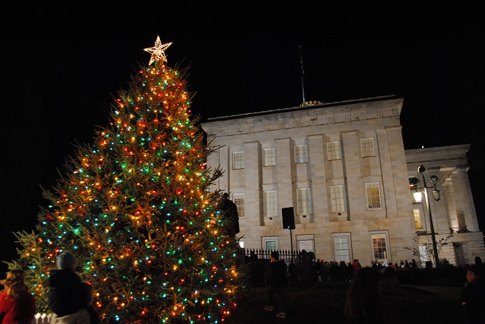 A massive Christmas tree in front of the NC Capitol building. 
