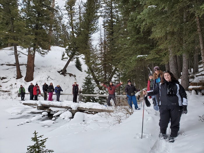 A group of educators adventure through the snow.