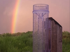 Rain gauge and rainbow.