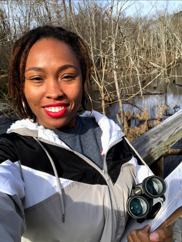Deja Perkins doing field work.