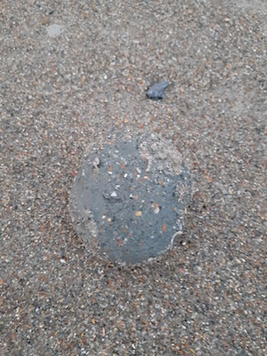 A squishy ball of sand appeared on the beach ground.