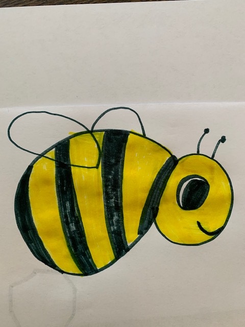 A child's drawing of a bee