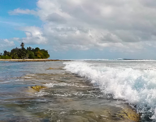 Waves meet the living bulwark on the leeward (western) side of South Keeling atoll