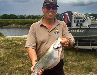 A man holding a big fish