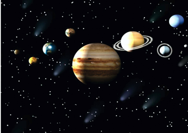The solar system with Jupiter in the foreground.