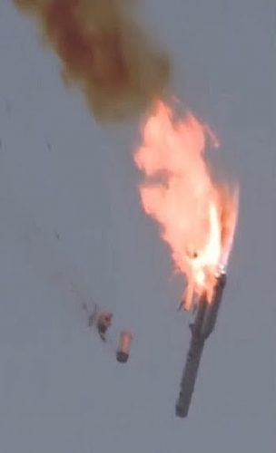 A rocket exploding with fire and smoke