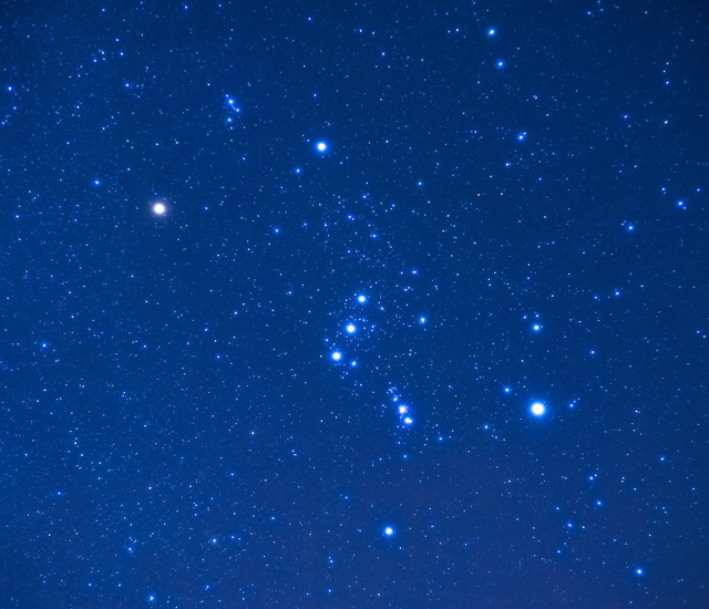 A blue sky with Orion's stars shining brightly.