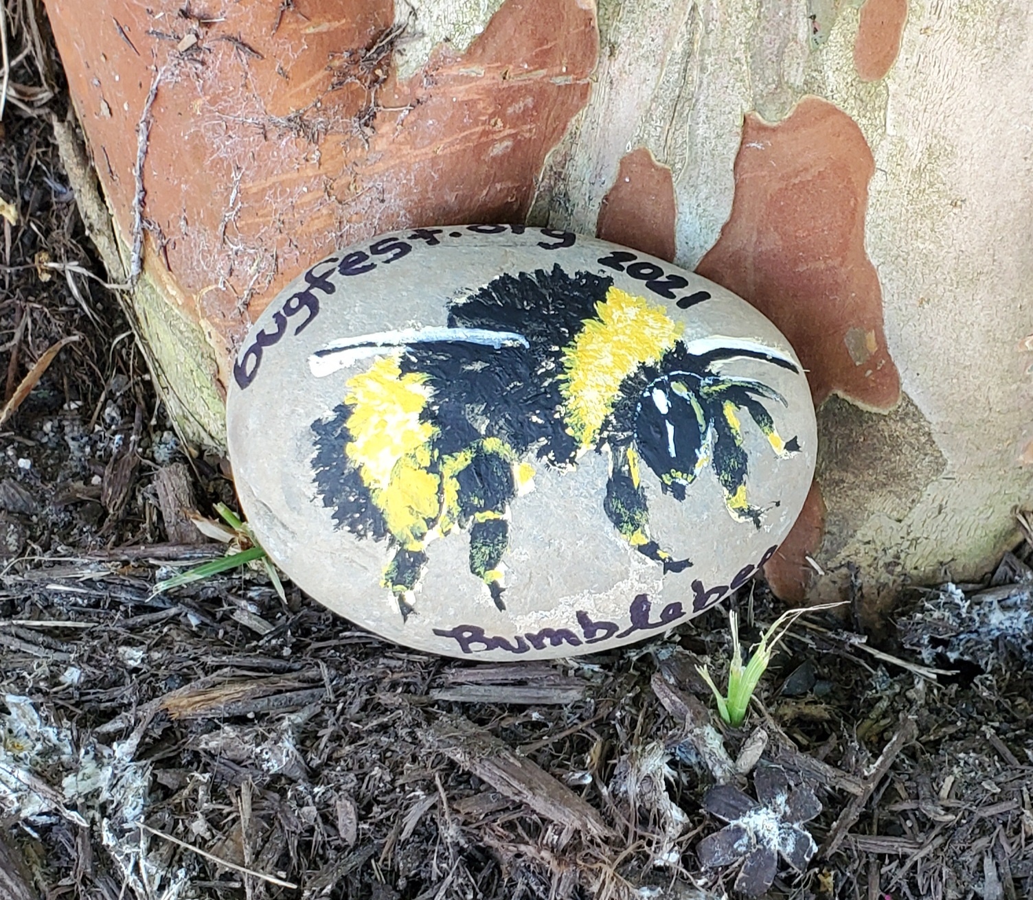 A bee painted on a rock