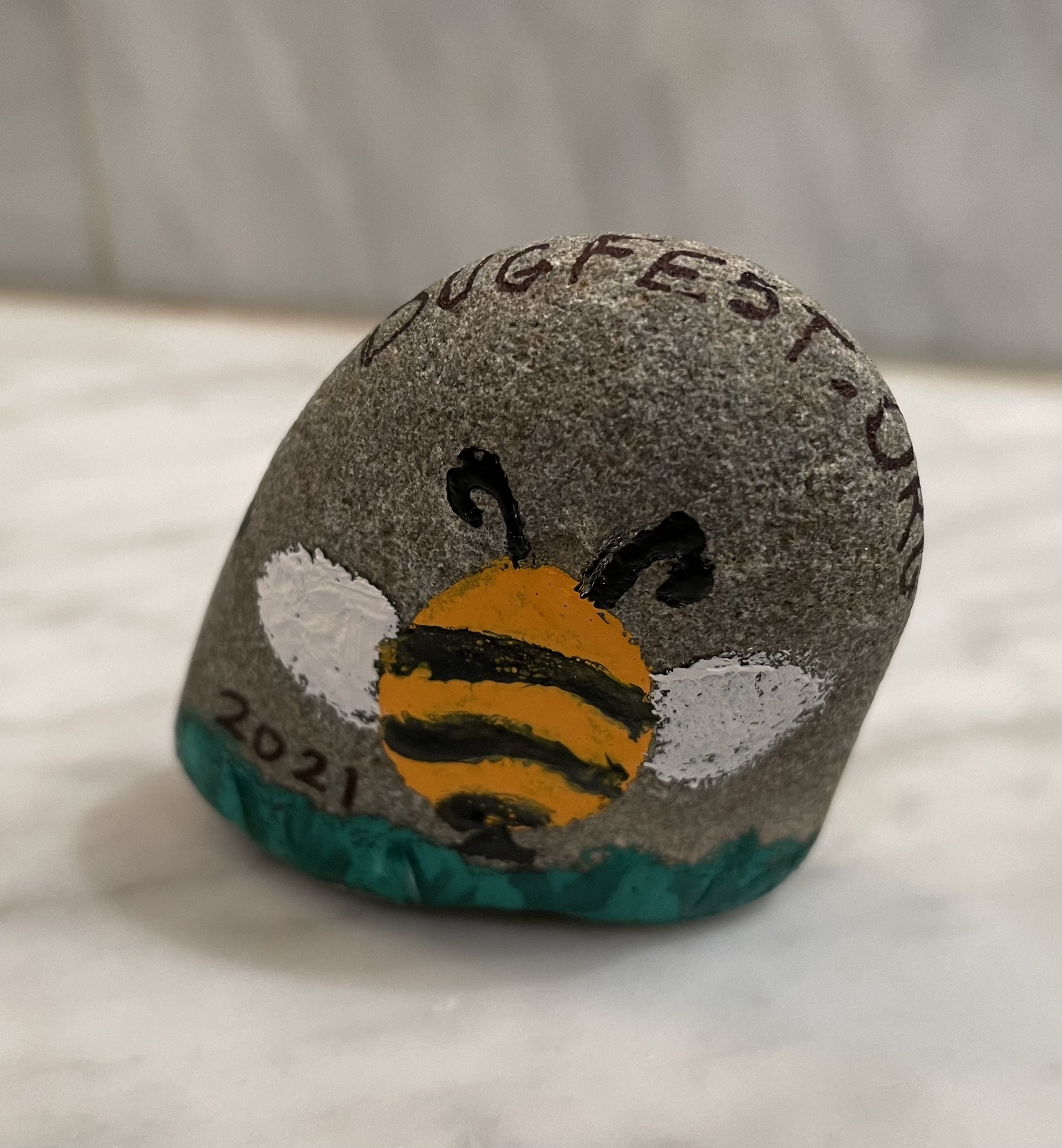 A bee painted on a rock
