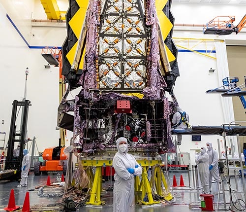 A person standing in front of JWST in the Lab