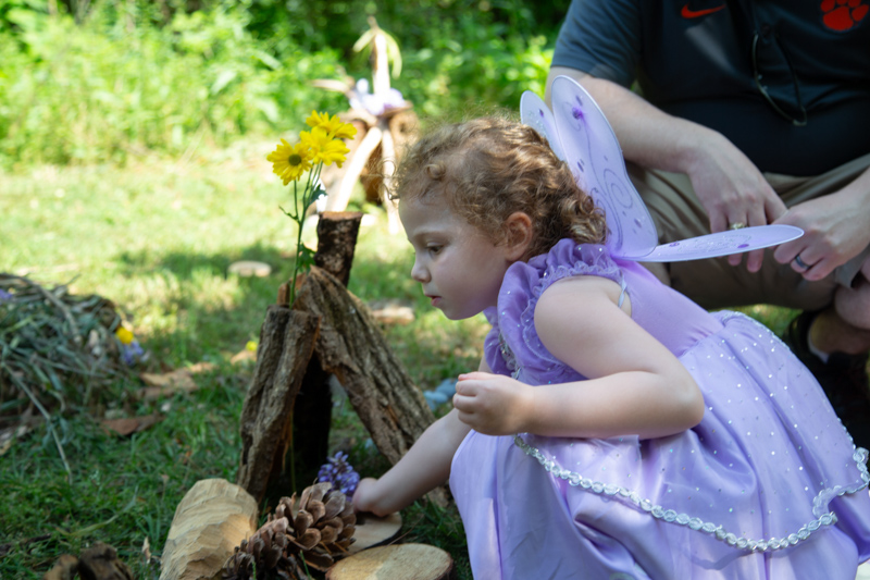 Small visitor making a fairy house at Gnome and Fairy Day 2019