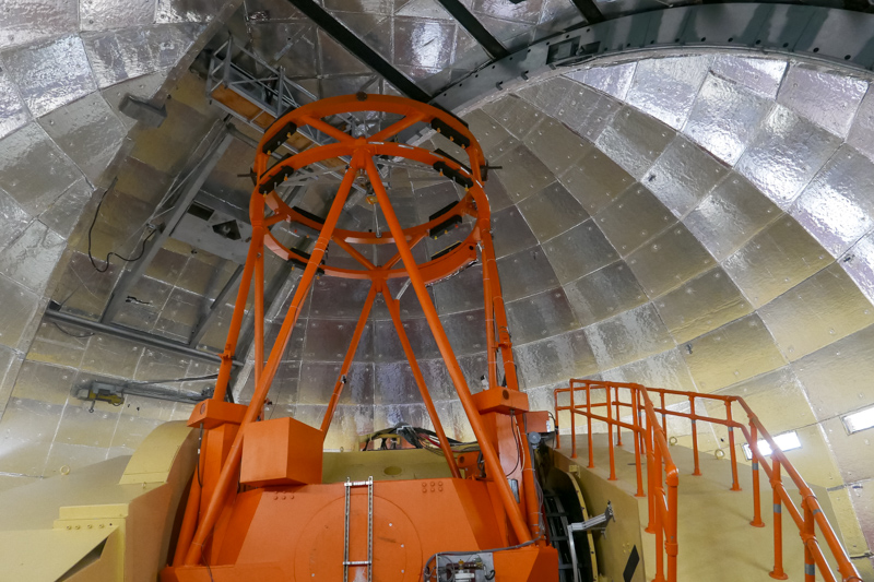 Inside the Infrared Telescope Facility dome, before opening for an evening of observing. The telescope is on the summit of Maunakea on the Big Island of Hawaii. Photo: R. Smith.