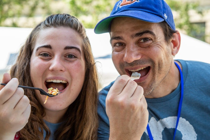 Two people enjoying "bug bites" from Cafe Insecta.