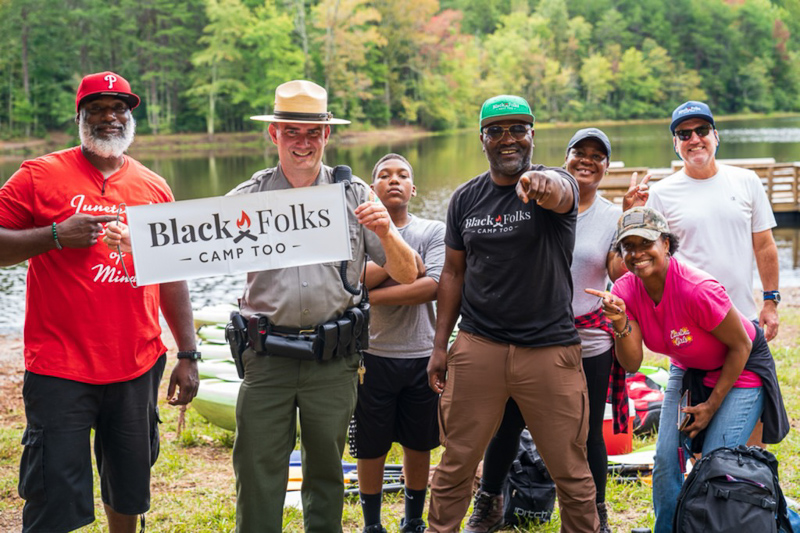 Earl B. Hunter, Jr. with park ranger and campers at Crowders Mountain State Park.