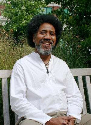 Portrait photo of Darrell Stover sitting on a bench.