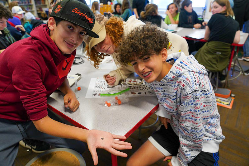 Students from Exploris Middle School in downtown Raleigh identify microfossils as part of the Cretaceous Creatures project.