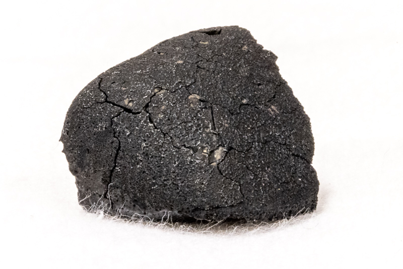 Top of the NCMNS Tarda meteorite, showing the fusion crust.