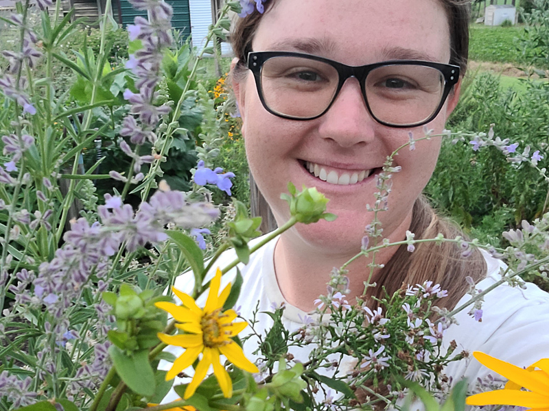 Amanda Wilkins among flowers