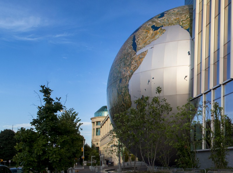 The SECU Daily Planet with the Acro Dome in the background in late day sun.