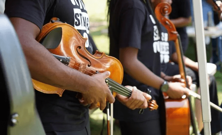 Closeup of musicians from United Strings of Color.