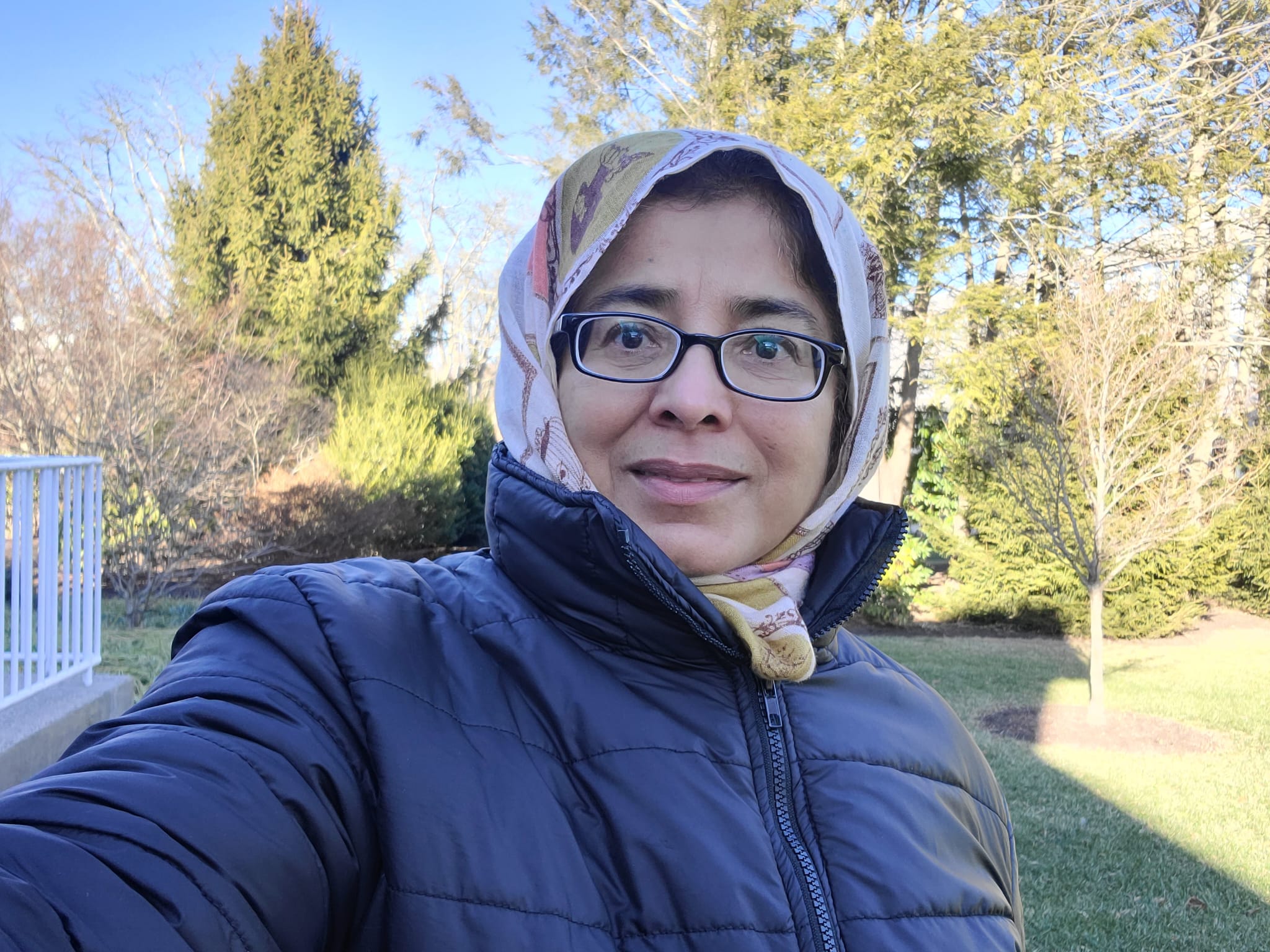 Selfie of Dr. Riffat Malik in a puffy coat and head scarf