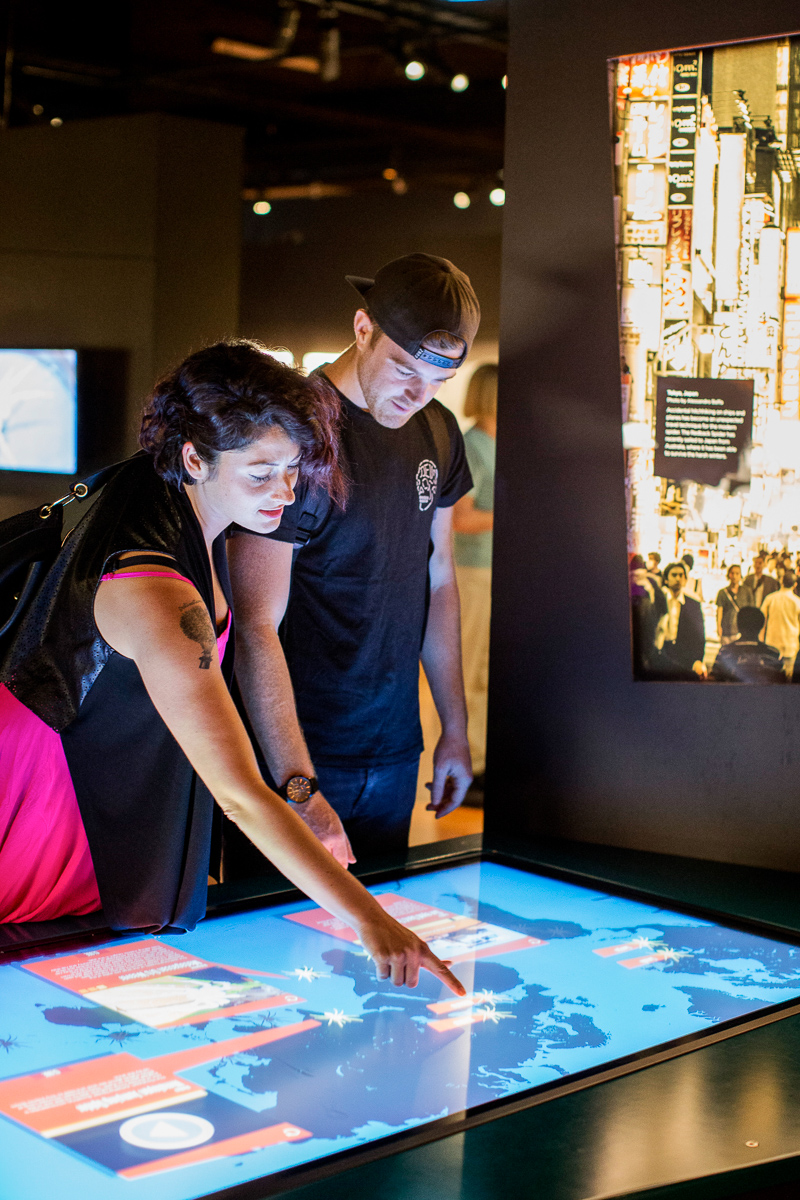 Through a world map of spider distribution on a large interactive touch-screen table, visitors can explore different parts of the globe and call up video footage, captioned images and facts about big, small, weird and wonderful spiders, including some of those featured in the exhibition. Photo: James Horan/Australian Museum.