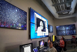 The Astronomy and Astrophysics Research Lab, showing a few of the visualizations, and research workstations.