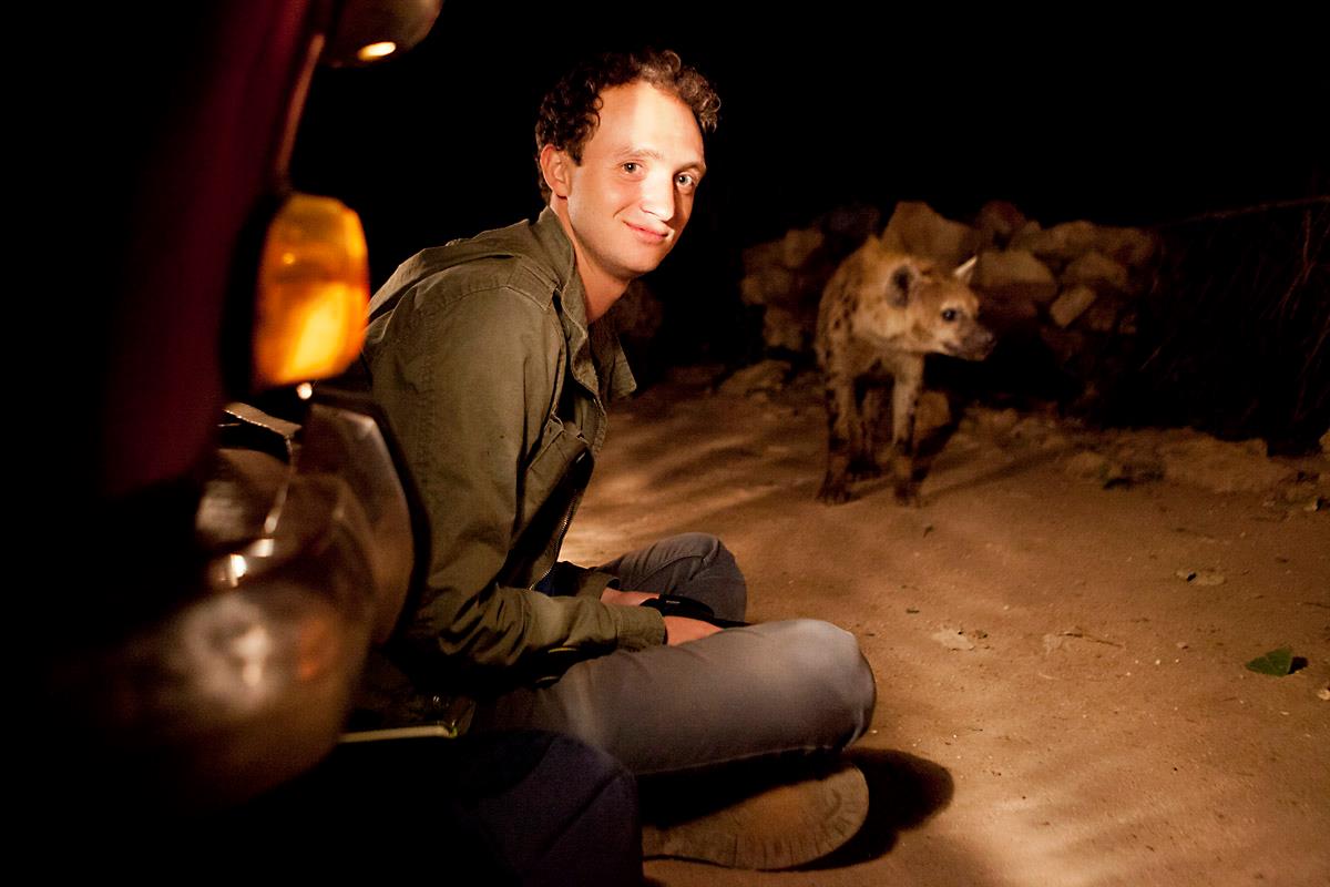 Dr. Eli Strauss studies hyenas in the Mara ecosystem of Kenya but this picture is him getting close to urban hyenas in Harar, Ethiopia.